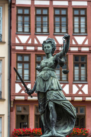 Frankfurt, July 26, 2016. Beautiful tatue at Fountain of Justice (Gerechtigkeitsbrunnen) in Romerberg (Roman Mountain) historic center of the Altstadt (old town), nowdays a popular tourist destination.のeditorial素材