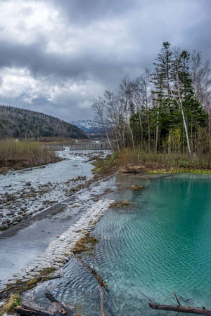 Biei, Kamikawa District, Hokkaido Prefecture, Japan. May 5, 2016. Biei River passing through Shirogane Blue Pond (Aoi-ike).のeditorial素材