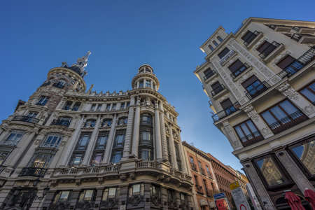 Madrid, Spain. January 9, 2017. Street level view of Plaza Canalejas. Edificio Meneses, Casa de Allende buildings and Calle del Principe.のeditorial素材
