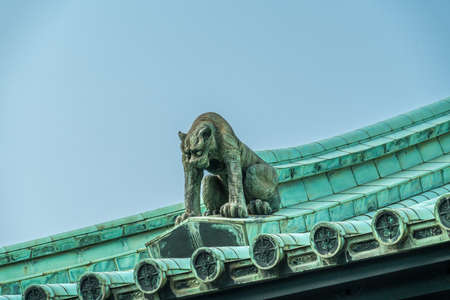 Tokyo - August 4, 2018 : Onigawara (Ogre goblin tile) gargoyle style roof ornaments at Taiseidan main hall of Yushima Seido Temple. Confucian temple from Genroku era of Edo periodのeditorial素材