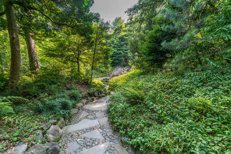 Tokyo, Bunkyo Ward - August 04, 2018 : Engetsu-kyo stone bridge at Koishikawa Korakuen Gardenのeditorial素材