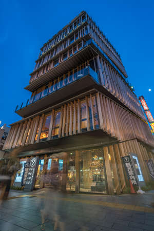 Tokyo, Taito Ward - August 18, 2018 : Motion Blurred people walking around Asakusa Culture Tourist Center designed by architect Kengo Kuma in Asakusa district, Tokyo, Japan.のeditorial素材