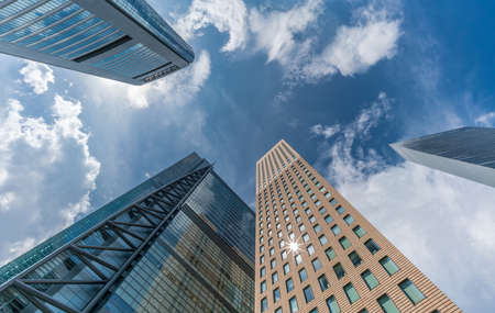 Minato Ward, Tokyo, Japan - August 13, 2018 : Street level view  of skyscraper buildings near Higashi-Shimbashi Area. Shiodome Media Tower, Nihon Terebi Tower, Royal Park Hotel Towerのeditorial素材