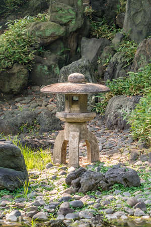 Tokyo, Bunkyo Ward - August 04, 2018 : Late summer landscape with stone lantern at Koishikawa Korakuen Gardenのeditorial素材