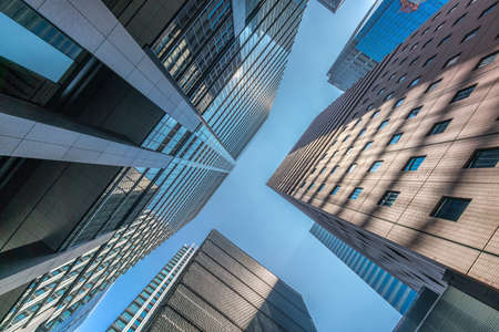 Tokyo - August 8, 2018 : Low angle view of skyscraper buildings scenery. Marunouchi financial...