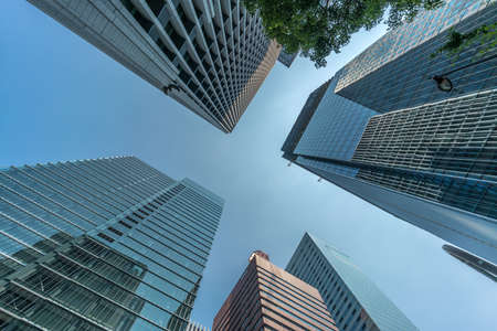 Tokyo - August 8, 2018 : Low angle view of skyscraper buildings scenery. Marunouchi financial...