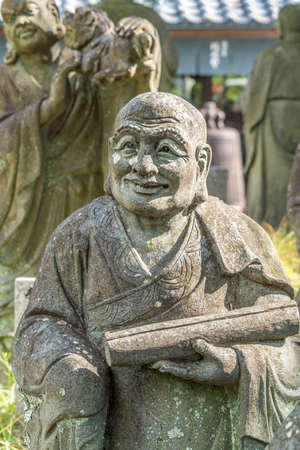 Kyoto, Japan - November 9, 2017 : Arashiyama Arhat. 500 Statues of the closest and highest disciples of Buddha in front of Hogon-in sub-temple of Tenryu-ji.のeditorial素材