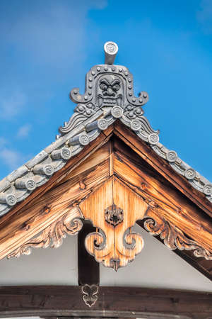 Onigawara (Goblin Ogre-face tile) and Gegyo (Gable pendant) at Honden (Main Hall) of Kogen-ji Temple...
