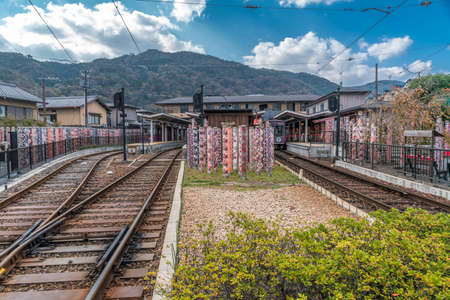 Arashiyama, Kyoto, Japan - November 9, 2017 : Kimono Forest at Randen Arashiyama Station, colorful cylinder-shaped pillars with kimono patterns of dyed fabric in Kyo-Yuzen style of dyeing and printingのeditorial素材