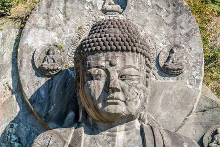 Mount Nokogiri (Nokogiriyama) Great Buddha (Nihon-ji daibutsu). Carving of seated sculpture of Yakushi Nyorai completed in 1783.  The largest pre-modern stone-carved Daibutsu in Japanのeditorial素材