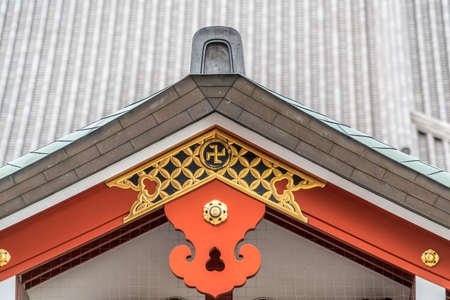 Asakusa, Tokyo, Japan - November 13, 2017: Gegyo (Gable Pendant), crooked cross and Kazarikanagu (Metal ornaments) roof ridge  deatil at Senso-ji templeのeditorial素材