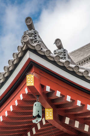 Asakusa, Tokyo, Japan - November 13, 2017: Onigawara (ogre goblin tile) roof ridge detail, crooked...