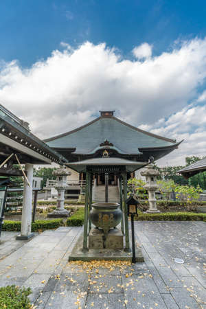 Zama city, Kanagawa Prefecture, Japan - November 15, 2017: Miyabori Carvings, Senjafuda stickers and Suzu hanging bell Shoukoku-ji Buddhist temple Kannondo Main Hall . Devoted to Hoshinoya kannonのeditorial素材