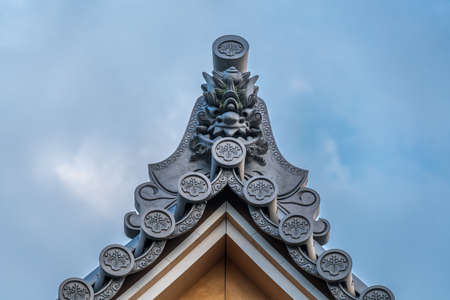 Zama city, Kanagawa Prefecture, Japan - November 15, 2017 : Beautiful Onigawara (Ogre tile) and toribusuma End tile at  Suijyousan Ryugein Temple.のeditorial素材