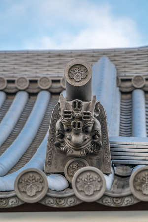 Zama city, Kanagawa Prefecture, Japan - November 15, 2017 : Beautiful Onigawara (Ogre tile) and toribusuma End tile at  Suijyousan Ryugein Temple.のeditorial素材
