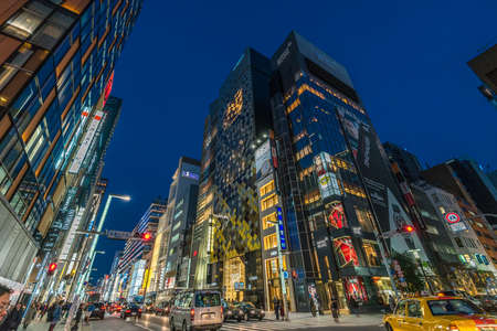 Ginza, Tokyo - December 2017 : Start of Christmas season in crowded Chuo dori street at Ginza luxurious shopping District by night.のeditorial素材