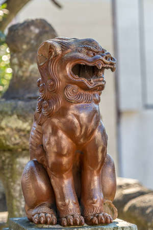 Kanaya, Futtsu-shi. Chiba prefecture, Japan - November 21, 2017 : Carved agyo (Open mouth) Komainu Lion-dog guardian at Kanaya Jinja, Shinto shrine located near the mount nokogiri ropeway.のeditorial素材