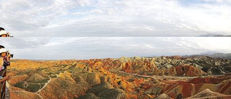 Panorama View of Rainbow Mountains Geological Park. Stripy Zhangye Danxia Landform Geological Park in Gansu Province, China. Road in a Valley on a Sunny Day.の写真素材