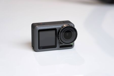 CHINA, SHANGHAI - MAY 18, 2019. CLOSEUP VIEW OF DJI OSMO ACTION AND WHITE BACKGROUND.
