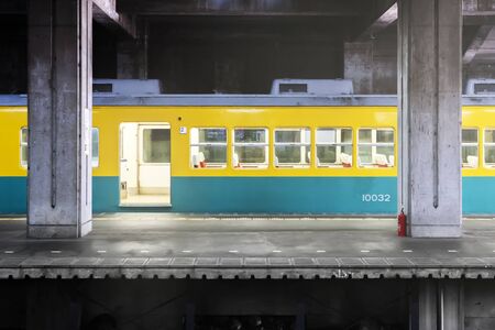 Open Door Of The Train. Yellow - Blue Green Coach And Railway Station And Platform.の写真素材