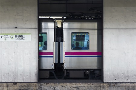 TOKYO, JAPAN - OCTOBER 6, 2018. Japanese Men Are Sitting In The Train At the Metro Station In Tokyo.