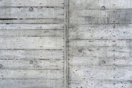 The Texture of Wooden Board Casing Decking of the Concrete Wall. Traces of the Timber Cast Mould for Cement Formwork.の写真素材