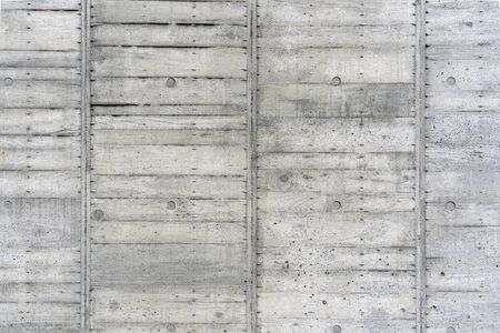 The Texture of Wooden Board Casing Decking of the Concrete Wall. Traces of the Timber Cast Mould for Cement Formwork.の写真素材