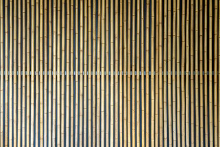 Texture of Yellow Bamboo Wall. Decoration Facade Made from Bamboo.の写真素材