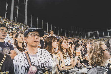 TOKYO, JAPAN - OCTOBER 7, 2018. Japanese Baseball Fans Are Supporting Their Team. People are Watching The Baseball Game on the Stadium.のeditorial素材