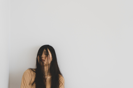 TOKYO, JAPAN - OCTOBER 8, 2018. Portrait Photography of the Pretty Sleeping Asian Girl. Half Of Face Covered By Woman's Hair. White Background.のeditorial素材