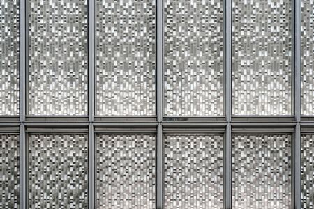 Facade Silver Glass Panels with Grey Color Frames. Reflecting and Metallic Gradient Texture.