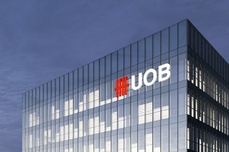 Singapore. February 27, 2021. Editorial Use Only, 3D CGI. UOB Signage Logo on Top of Glass Building. United Overseas Bank Corporation Company in High-rise Office Headquarter.のeditorial素材