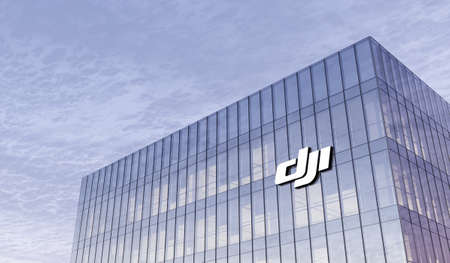 Shenzhen, China. February 25, 2021. Editorial Use Only, 3D CGI. SZ DJI Technology Co. Signage Logo on Top of Glass Building. Workplace of Robot Sciences Company in High-rise Office Headquarter.のeditorial素材