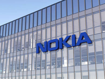 Espoo, Finland. May 2, 2022. Editorial Use Only, 3D CGI. Nokia Signage Logo on Top of Glass Building. Workplace Telecommunications Equipment Company Office Headquarters.のeditorial素材