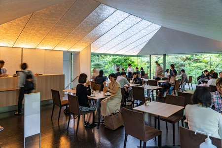 TOKYO, JAPAN - OCTOBER 8, 2018. Japanese People are Having Coffee in a Cafe in the Forest. Restaurant in the Garden. Couples and Nature.のeditorial素材