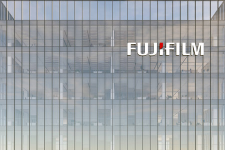 Minato City, Tokyo, Japan. May 2, 2022. Editorial Use Only, 3D CGI. Fujifilm Signage Logo on Top of Glass Building. Workplace of Technological Company Office Headquarters.のeditorial素材
