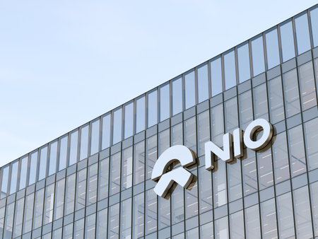 Shanghai, China. May 2, 2023. Editorial Use Only, 3D CGI. NIO Company Signage Logo on Top of Glass Building. Workplace Electric Vehicles Automaker Office Headquarters.のeditorial素材