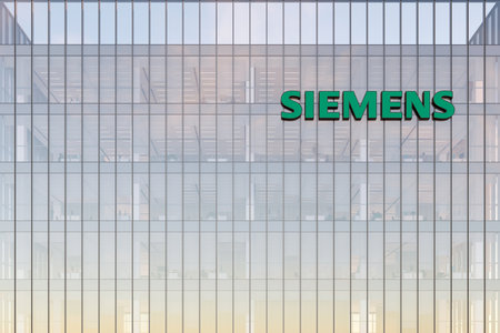 Munich, Germany. May 2, 2022. Editorial Use Only, 3D CGI. Siemens Signage Logo on Top of Glass Building. Workplace Automation Company Office Headquarters.のeditorial素材