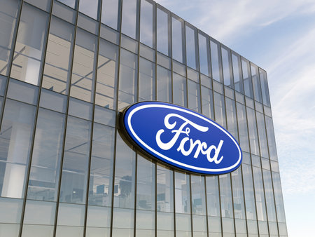 Dearborn, Michigan, USA. May 2, 2022. Editorial Use Only, 3D CGI. Ford Motor Company Signage Logo on Top of Glass Building. Automobile Manufacturer in High-rise Office Headquarters.のeditorial素材