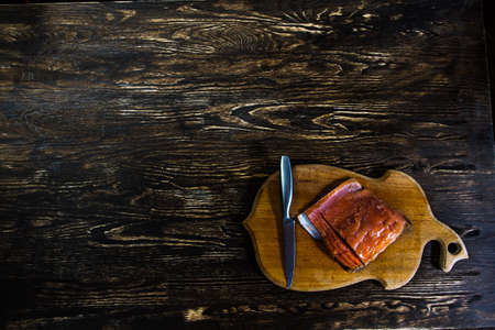 Tasty salmon fillet looks good on the old wood.  Image have free space for needed design for you.の写真素材