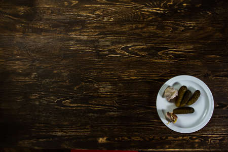Tasty cucumbers and garlic looks good on the old wood.  Image have free space for needed design for you.の写真素材
