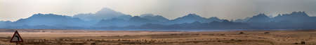 Sinai desert and mountains in the blue-gray hazeの写真素材