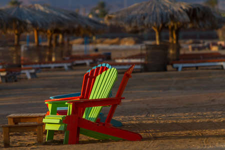 Umbrellas, beach chairs, tents on the beach in the sun when the dawn.の写真素材