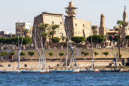 Nile river. Ships, yachts, fishing boats against the backdrop of ancient templesの写真素材