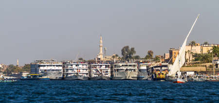 Nile river. Ships, yachts, fishing boats against the backdrop of ancient templesのeditorial素材