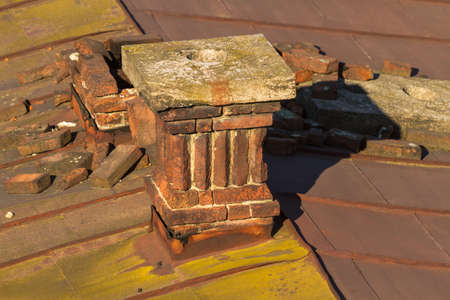 A view from above on the roofs of the old town of Mukachevo, on which sometimes there are still real chimney sweeps. Ukraine.の写真素材