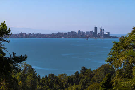 View of Skyscrapers Batumi on the background of surrounding mountainsの写真素材