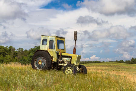 The model of the old tracor is installed in the steppe. Ukrainian native landscapes.の写真素材
