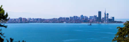 View of Skyscrapers Batumi on the background of surrounding mountainsの写真素材