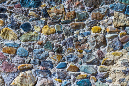 Background, texture, multi-colored stones of different shapes in solutionの写真素材